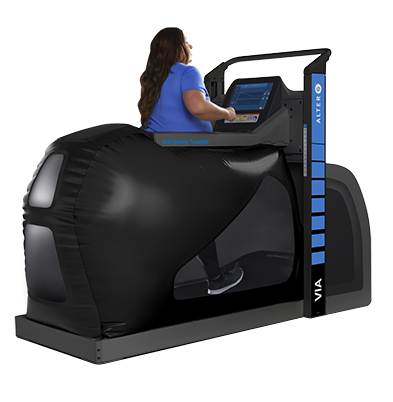 Woman walking in large black treadmill